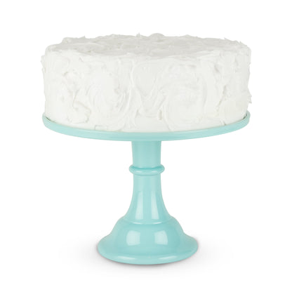 Mint green melamine cake stand with a white cake on top