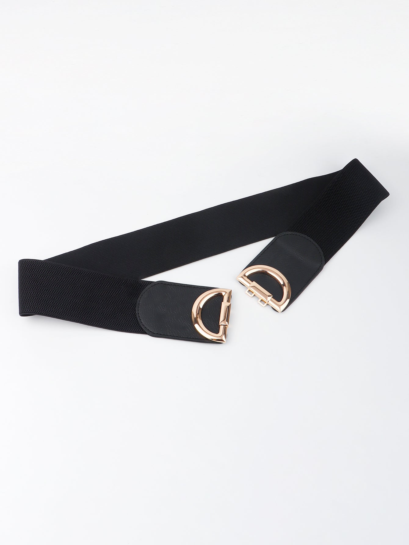 Black belt with gold hardware on a white background