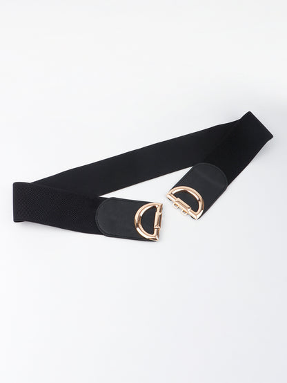 Black belt with gold hardware on a white background