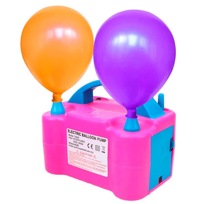 Electric party balloon inflator in pink with orange and purple balloons attached, featuring a handle and safety label.