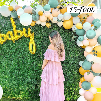 Balloon garland with woman standing under it to show the size.