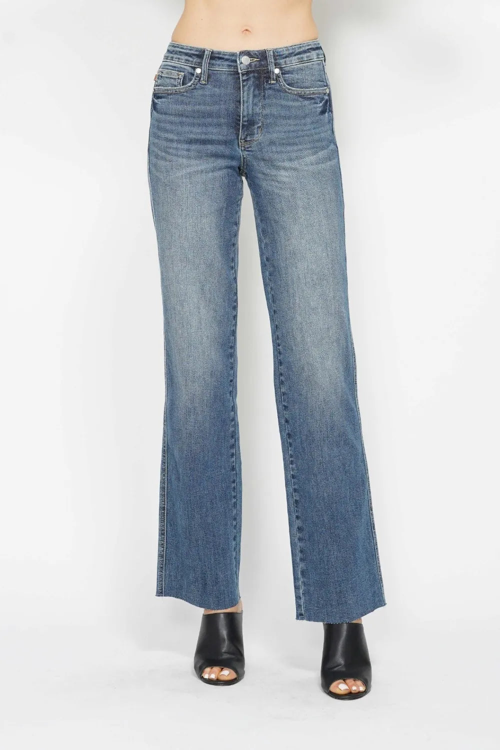 Women's Judy Blue tummy control straight leg jeans in medium wash, front view on model showcasing smoothing waistband and flattering fit, boutique denim product photography