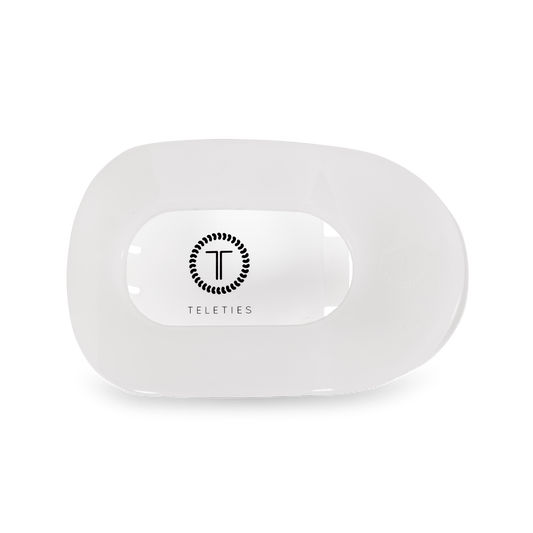 White electronic device with 'Teleties' branding on a green background