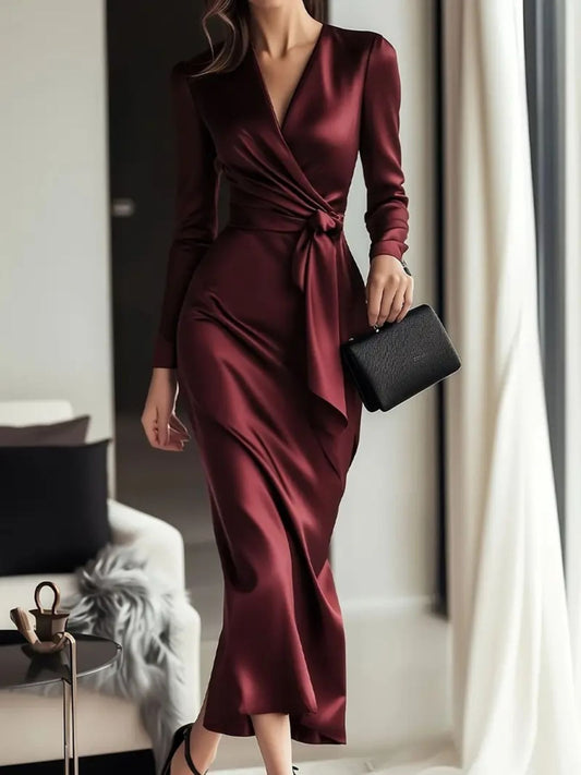 Front View: Satin tie waist long sleeve dress front view showing fluid fabric with ruched detailing and adjustable tie belt