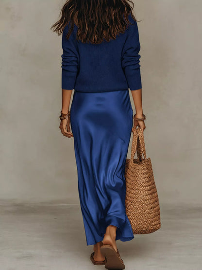 Back view of dark blue ribbed top and satin midi skirt set.