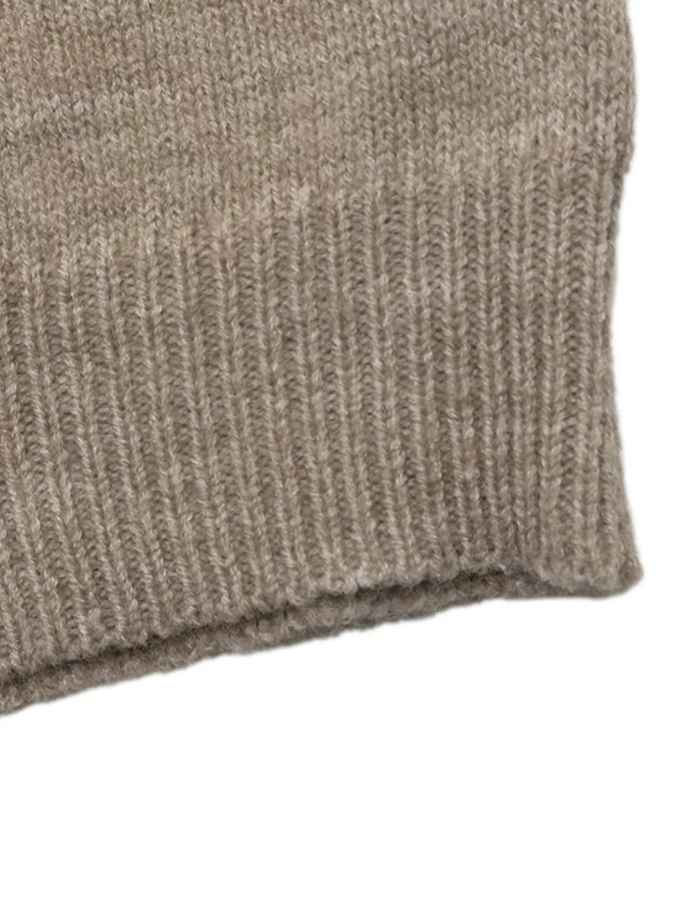 Close-up of a ribbed knit fabric cuff in a heathered taupe-beige color, showing the texture and stitching detail against a plain white background.