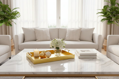 Gold tray with handles on a white coffee table.