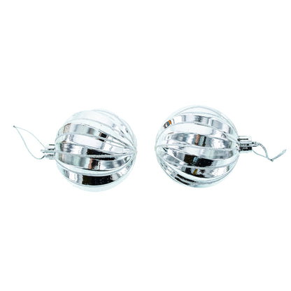 Two round silver plastic ornaments with a ribbed texture and hanging loops on a white background.