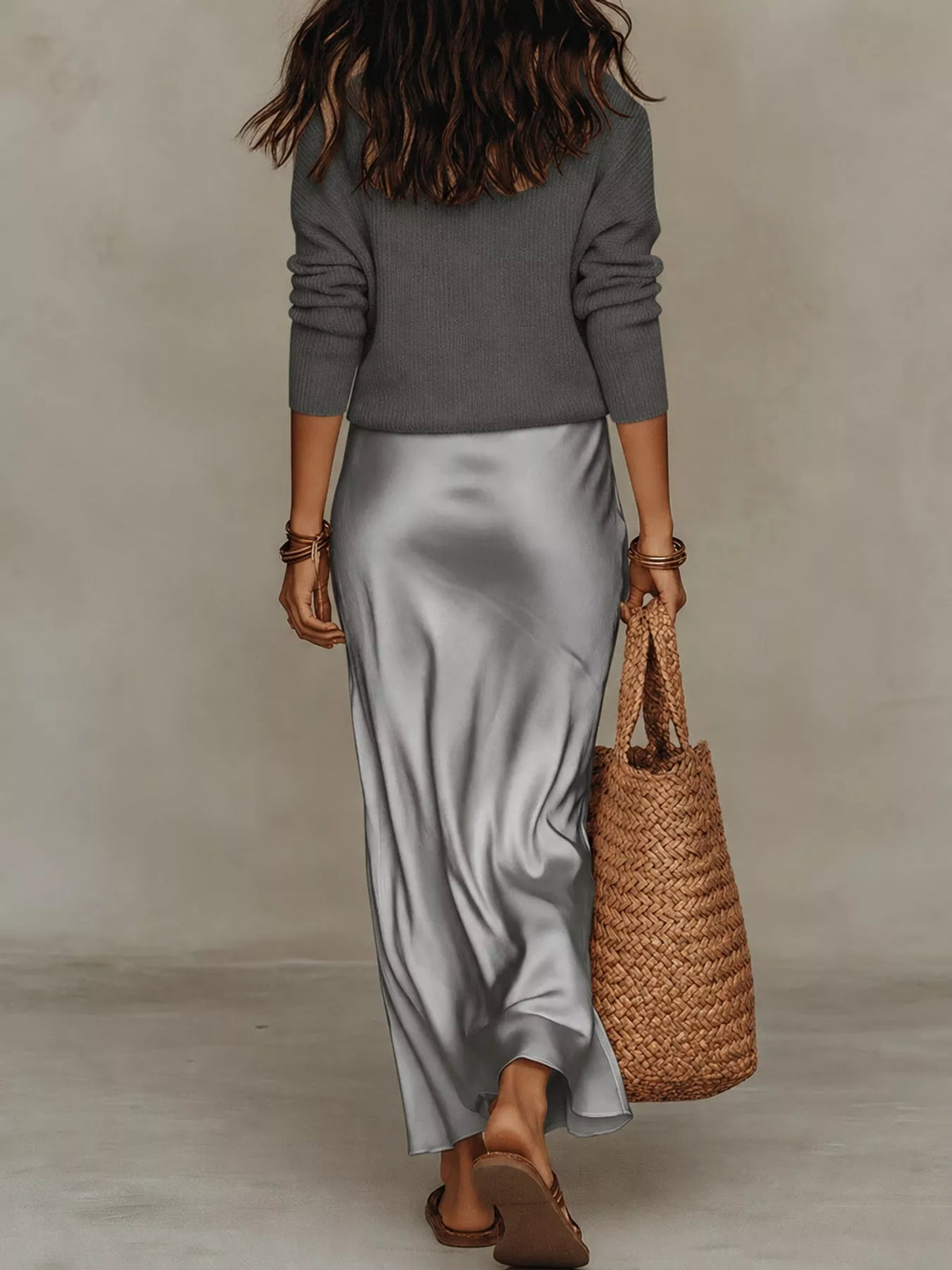 Back view of gray ribbed top and silver-gray satin midi skirt.