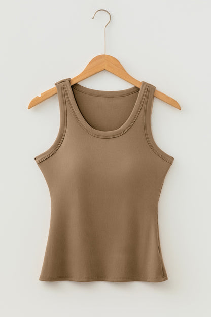 Brown ribbed fabric tank top with a scoop neck hanging on a light wood hanger against a white wall.