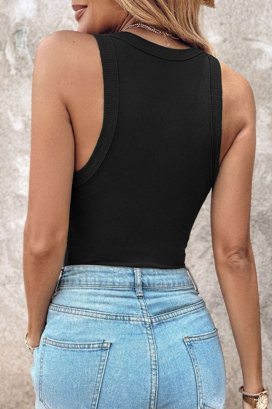 Rear view of a person wearing a black ribbed fabric tank top tucked into light blue denim jeans.