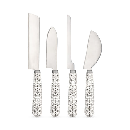 Four stainless steel cheese knives with black-and-white tile-patterned ceramic handles on a white background.