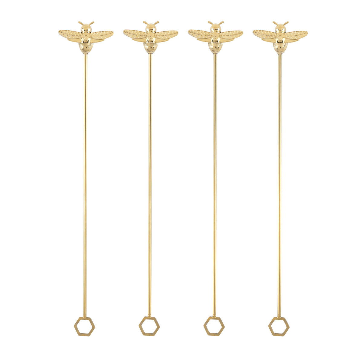 Set of four gold bumble bee stir sticks with hexagonal ends on a white background.