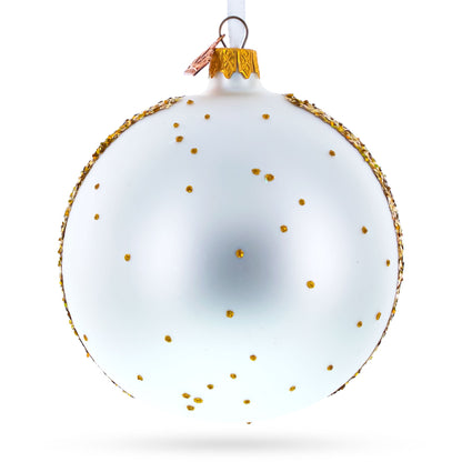 White glass ball ornament with gold accents and speckles, featuring a decorative top, 4 inches in diameter.