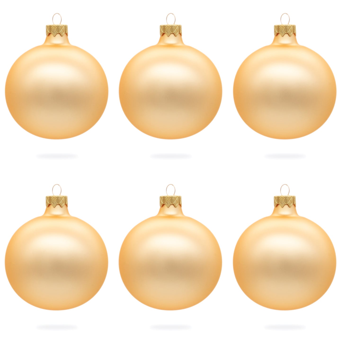 Six rose gold glass ball ornaments with a matte finish arranged in two rows of three on a white background.