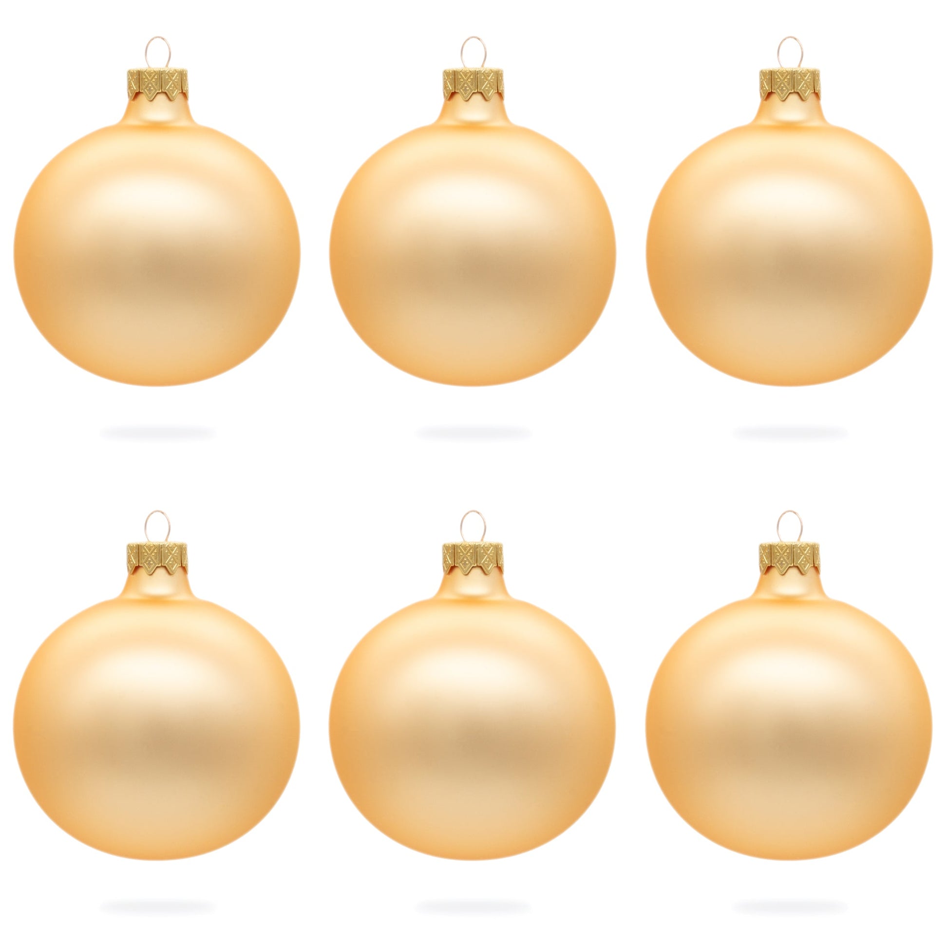 Six rose gold glass ball ornaments with a matte finish arranged in two rows of three on a white background.