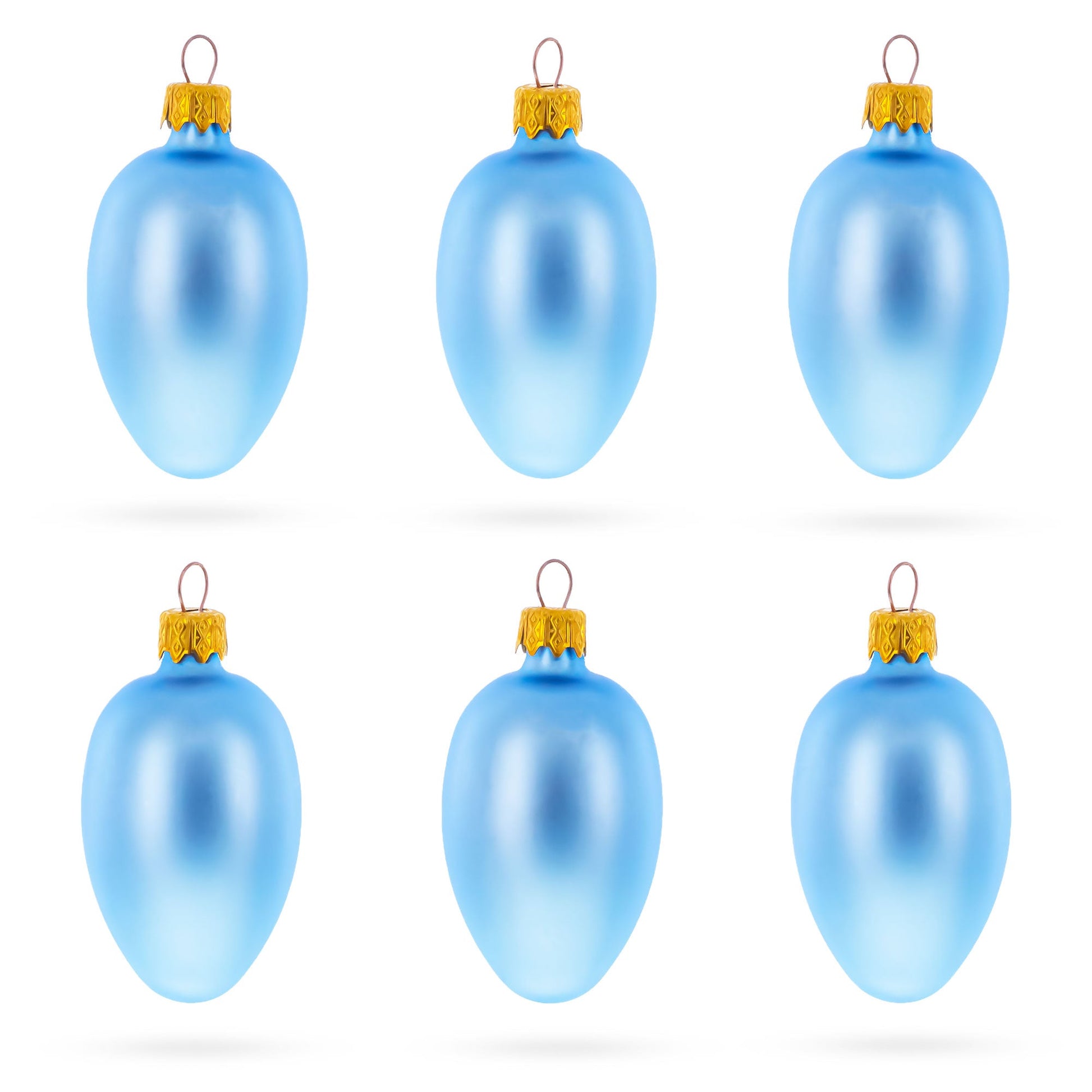 Six light blue matte glass egg ornaments with gold caps arranged in two rows of three on a white background.