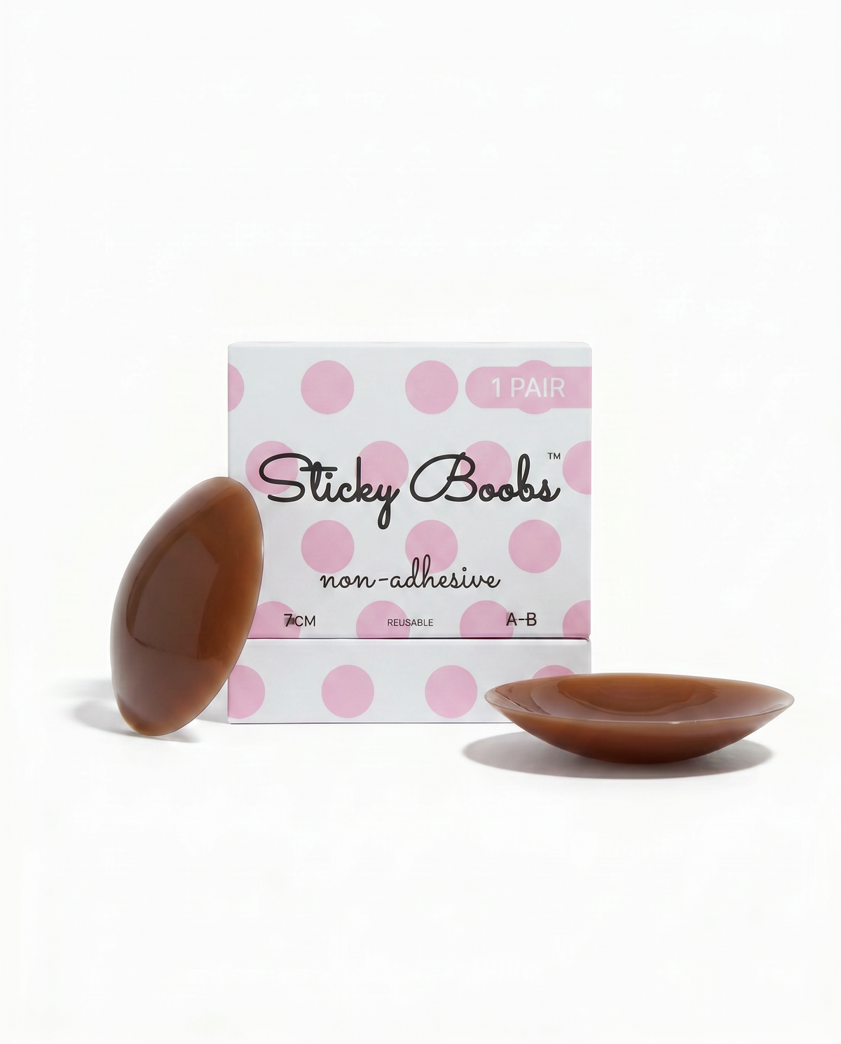 Dark non-adhesive silicone nipple covers with Sticky Boobs packaging labeled A–B, 7 cm.