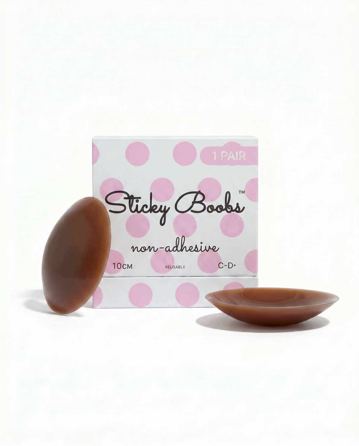 Dark non-adhesive silicone nipple covers with Sticky Boobs packaging labeled C–D+, 10 cm.