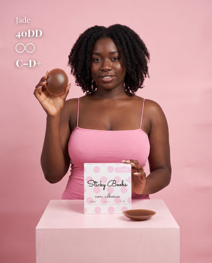 Model in a pink camisole holding a Dark nipple cover beside C–D+ packaging, labeled 40DD.
