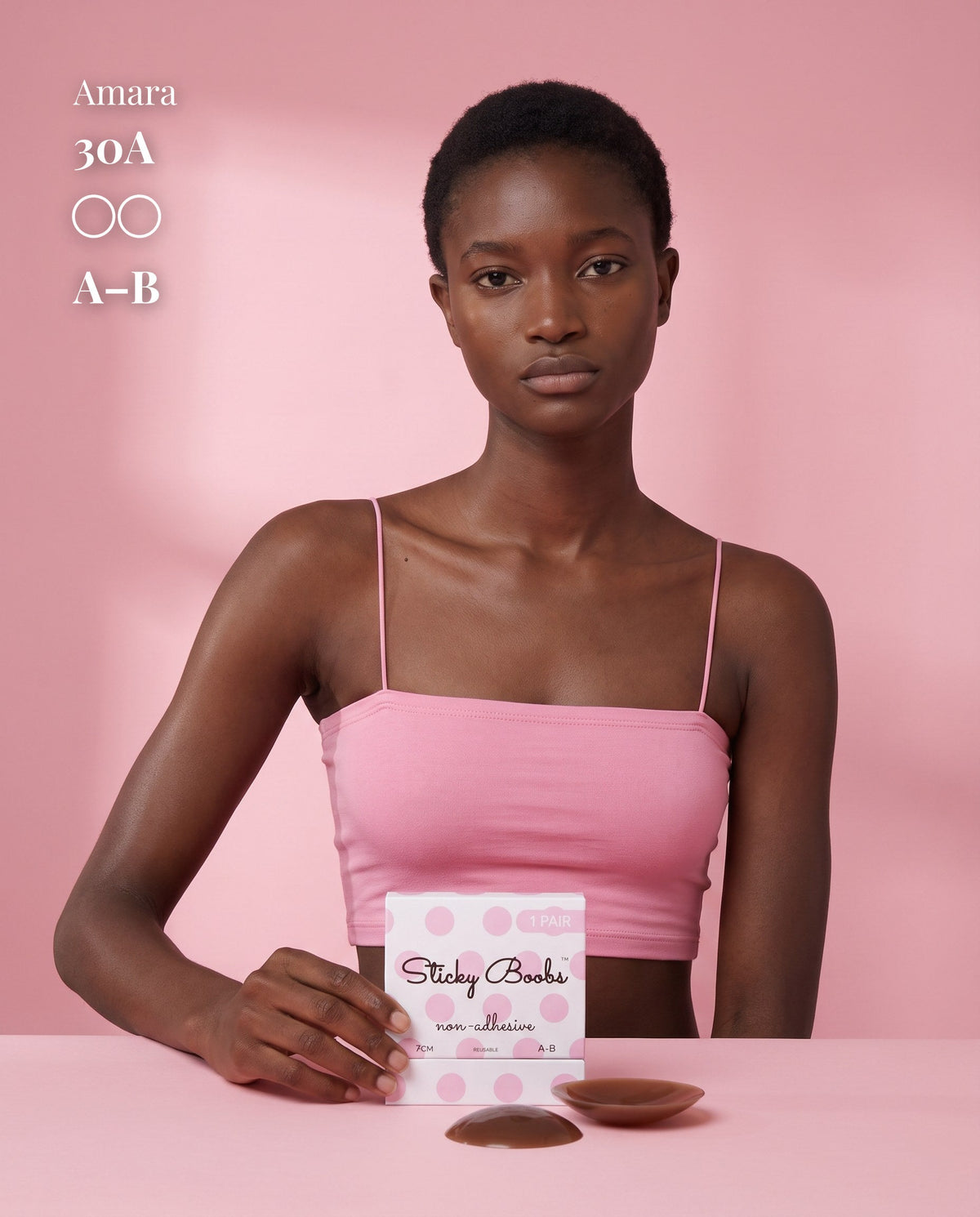 Model in a pink crop top beside Dark nipple covers and A–B packaging, with a 30A size label.