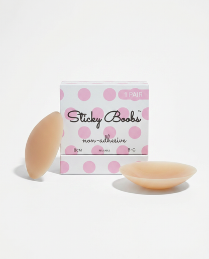 Tan non-adhesive silicone nipple covers with Sticky Boobs packaging labeled B–C, 8 cm.