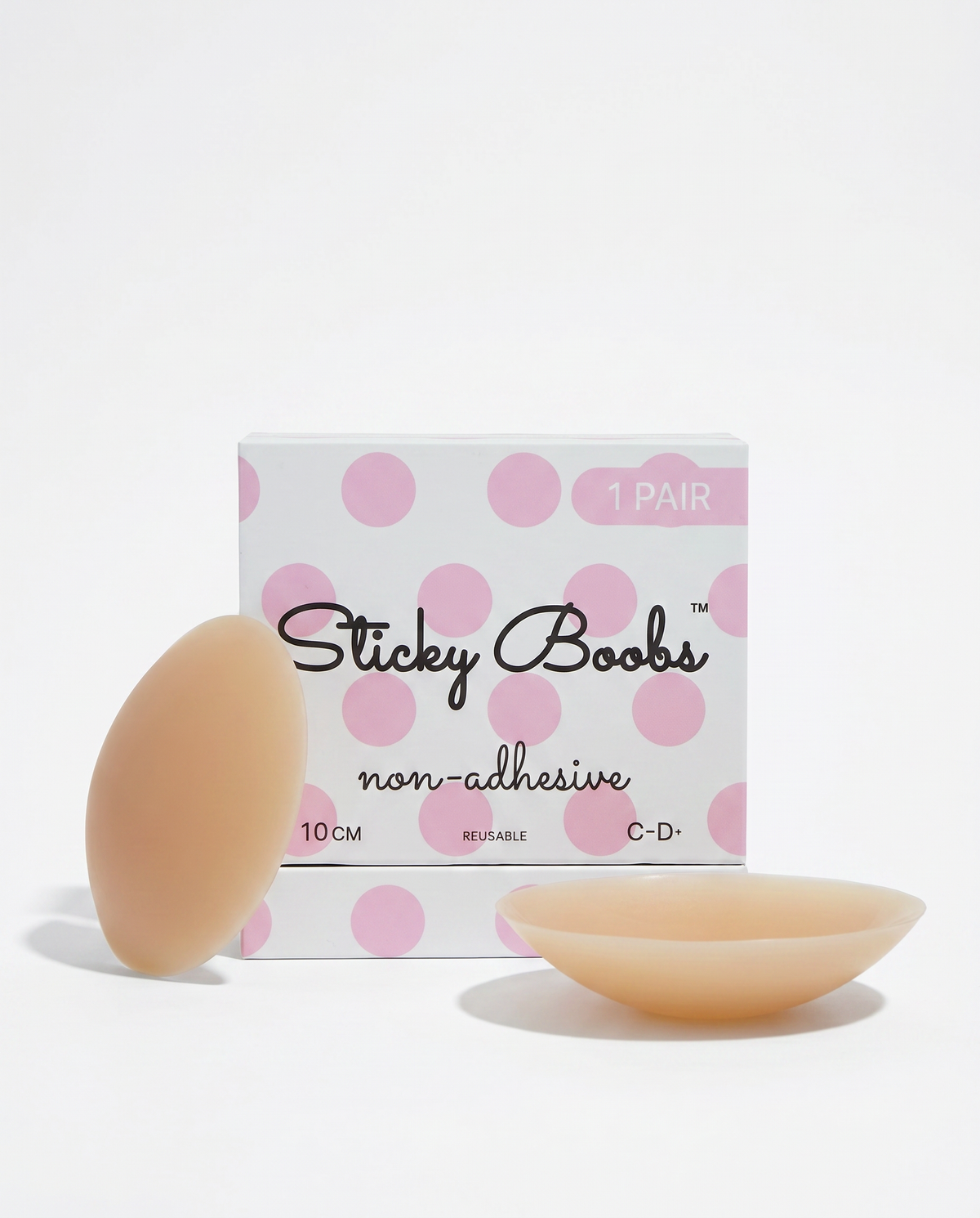 Tan non-adhesive silicone nipple covers with Sticky Boobs packaging labeled C–D+, 10 cm.