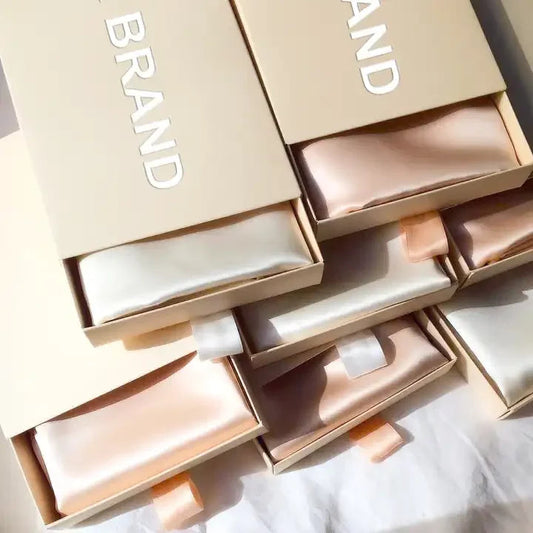 Silk pillow cases in a 'BRAND' box on a white background
