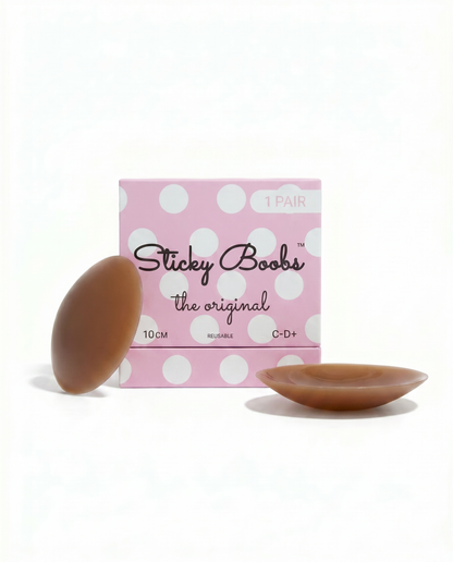 Dark Original Sticky Boobs silicone nipple covers with pink packaging labeled C–D+, 10 cm.
