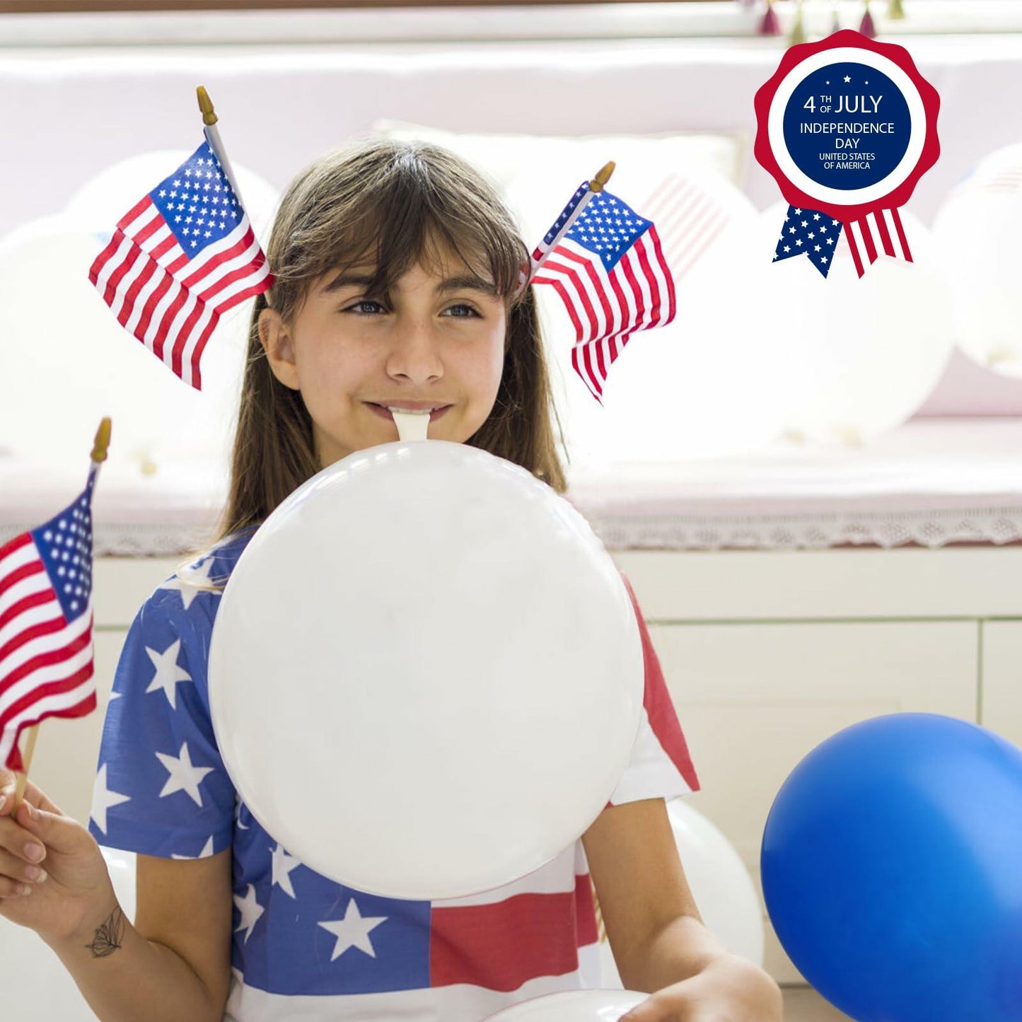 Girl holding a white balloon with American flags and balloons in the background, celebrating 4th of July.