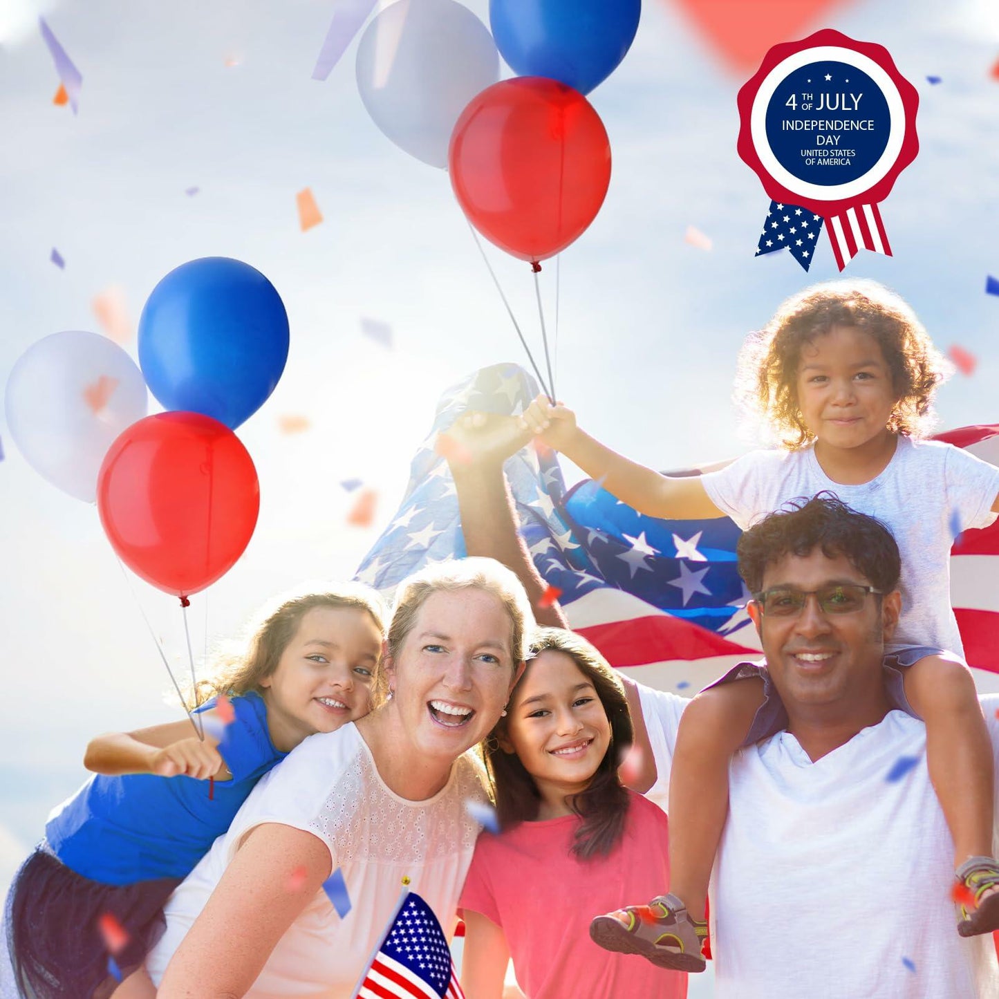 Family with children holding balloons and an American flag, celebrating 4th of July.