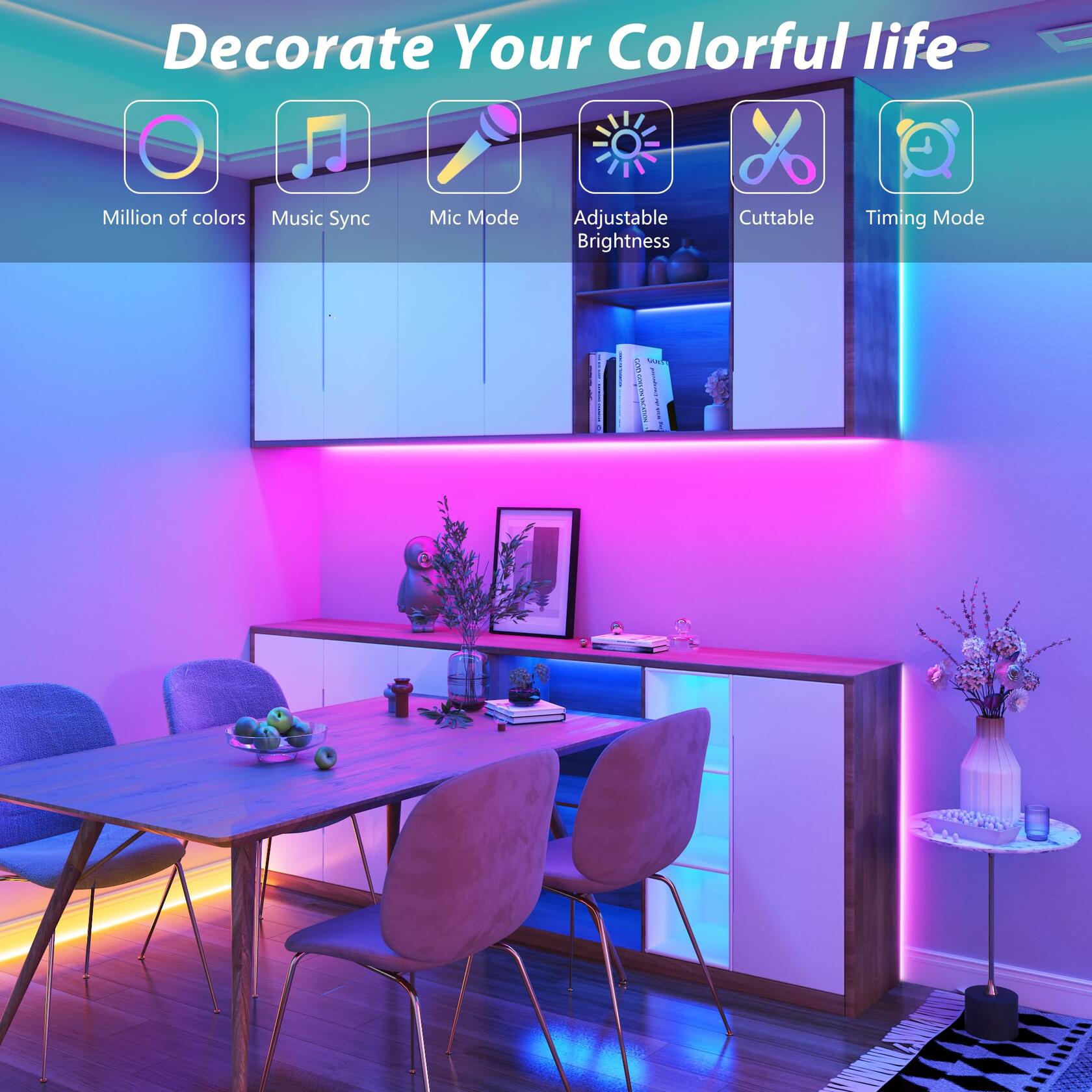 Multicolor RGB strip lights glowing pink and blue behind a wooden dining table and white cabinets in a modern room.