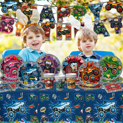 Truck-themed birthday party supplies including plates, napkins, cups, and a colorful banner with children wearing bunny ears.