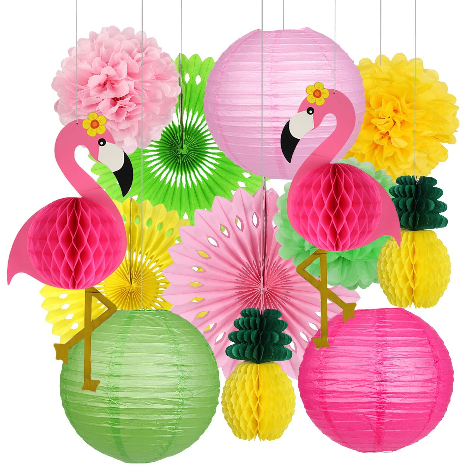 Flamingo pineapple party decorations featuring pink and green paper lanterns, pom poms, and honeycomb shapes.