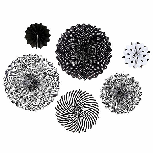 Black hanging paper fans in various designs, including stripes and polka dots, arranged in a circular pattern.