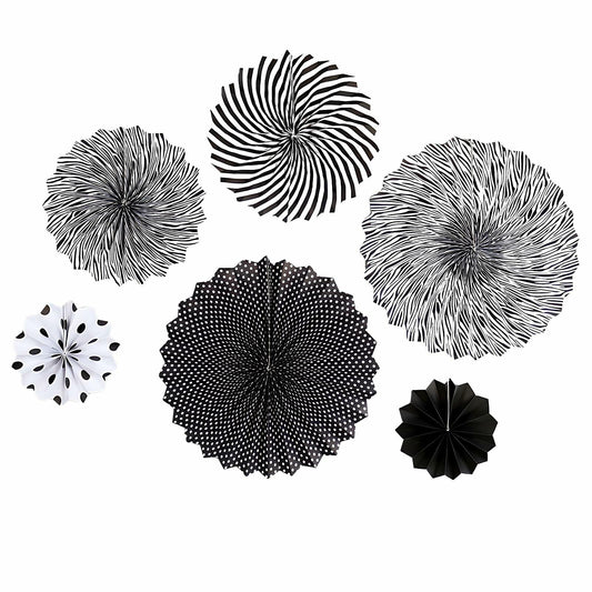 Black hanging paper fans in various sizes and patterns, including stripes, polka dots, and floral designs.