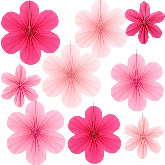 Pink paper fans and flowers party decorations set, featuring nine pieces in various shades of pink and white.