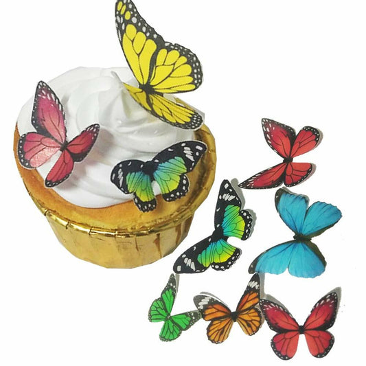 Edible butterflies in mixed colors, arranged on a cupcake with white frosting, featuring various butterfly designs.