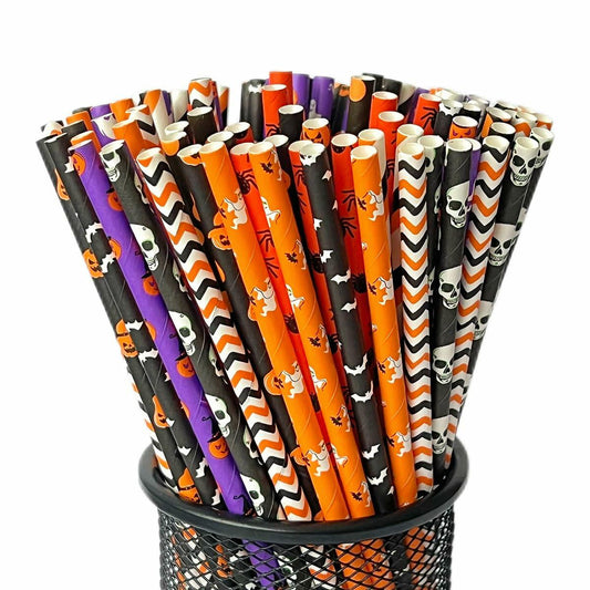 Halloween paper straws in mixed styles, featuring orange, black, purple, and white designs, displayed in a black holder.