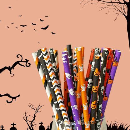 Halloween paper straws in various designs, including ghosts, pumpkins, and spiders, displayed in a clear glass.