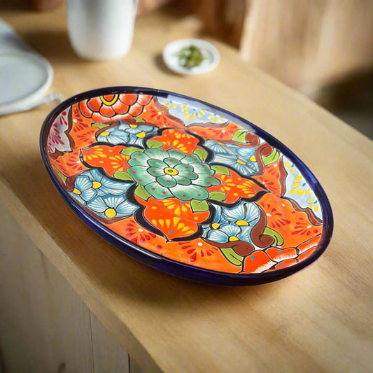 Colorful floral-patterned ceramic platter on a wooden table