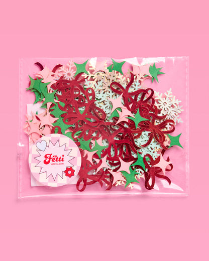Decorative paper cutouts in red, green, and pink on a pink background with 'Ferré' branding.