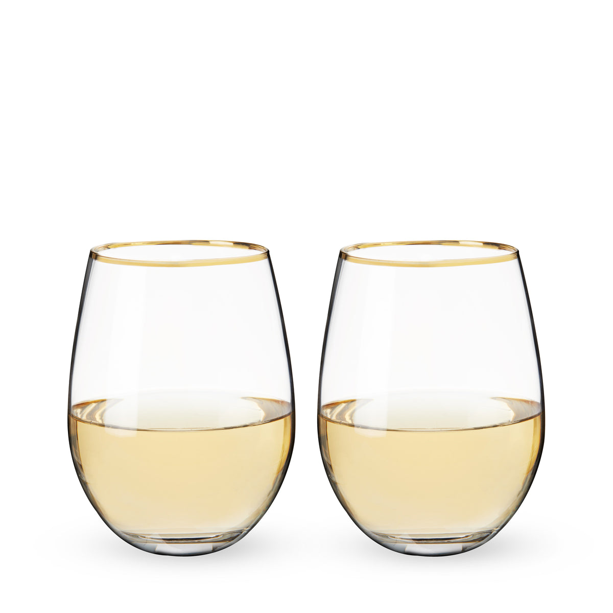 Two stemless wine glasses with gold rims filled with white wine on a white background