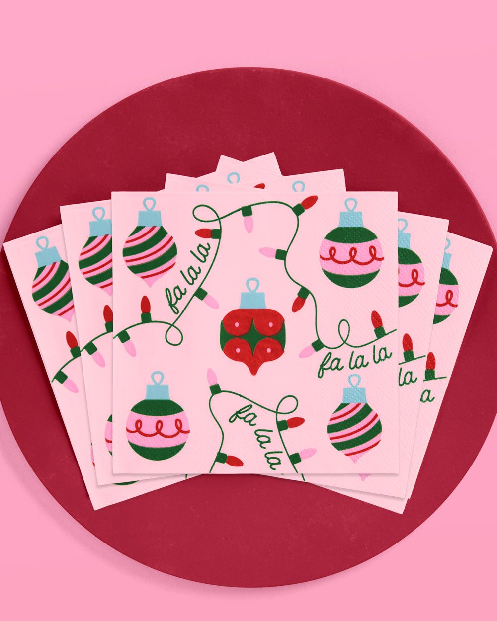 Set of Christmas-themed cards with ornaments and lights on a pink background