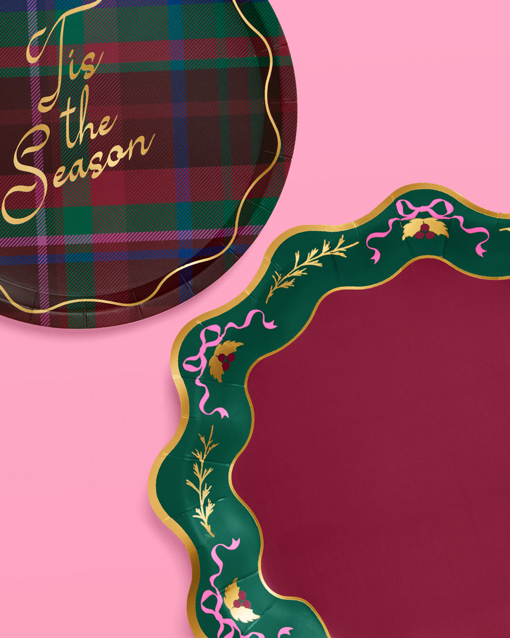 Two decorative plates with plaid and ornate designs on a pink background