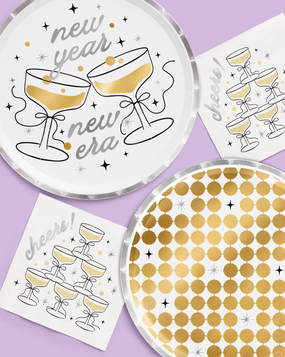 Decorative plates with champagne glass designs and 'new year new era' text on a purple background.