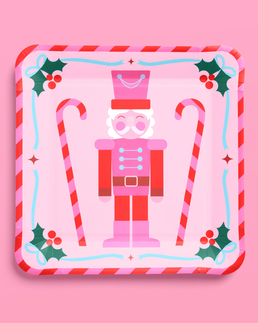 Decorative plate with a nutcracker design on a pink background