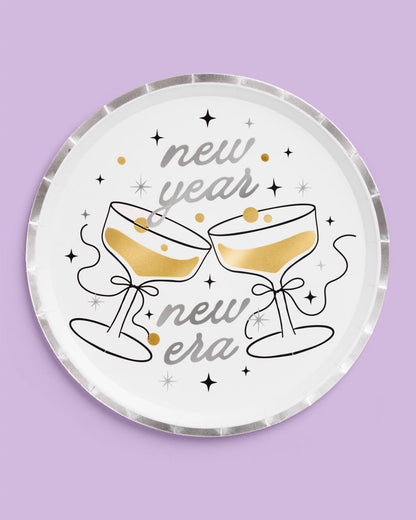 Decorative plate with 'new year new era' text and champagne glass illustrations on a purple background