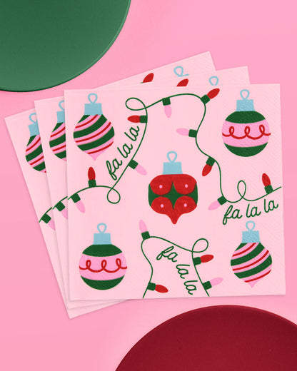 Two sheets of Christmas-themed stickers with ornaments and 'fa la la' text on a pink background.