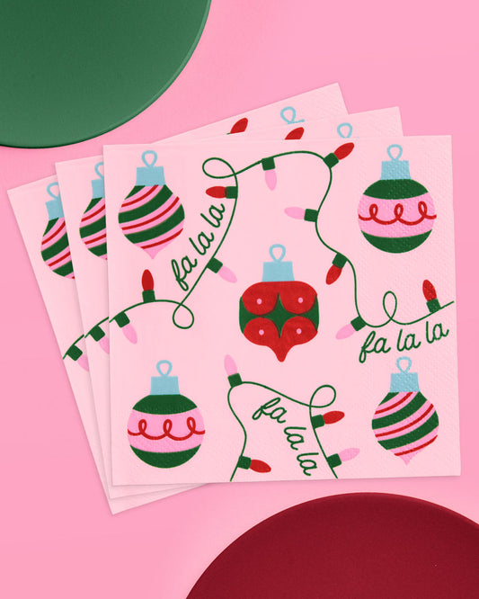 Two sheets of Christmas-themed stickers with ornaments and 'fa la la' text on a pink background.